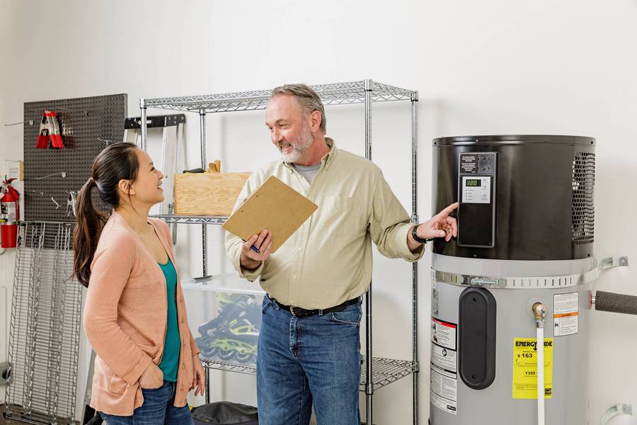Contractor explains heat pump water heater to customer